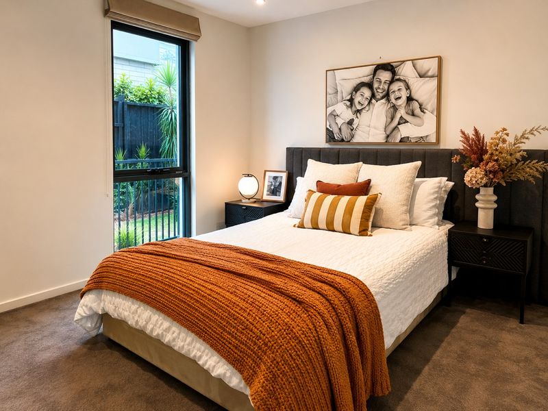 Queen bedroom with warm coastal styling