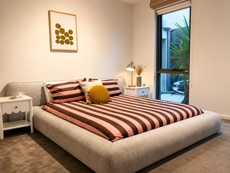 King bedroom with reading lamps and generous floor space
