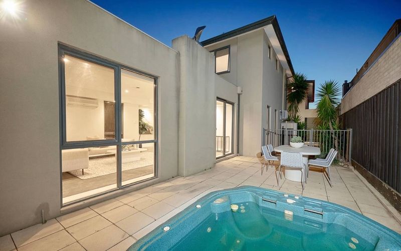 Private heated spa beside the landscaped outdoor entertaining area